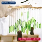 Yu Feng Natural Green Leaf Glass Wind Chime, Handcrafted With Iron Wood-look New. Price: $23.42.